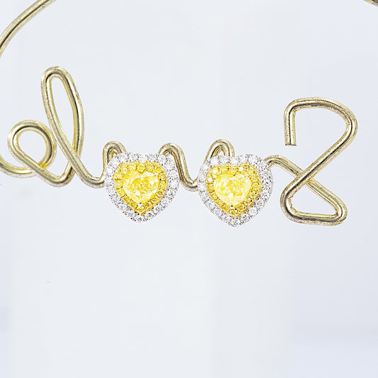 Heart Shaped Yellow Diamond Stud Earrings in White Gold