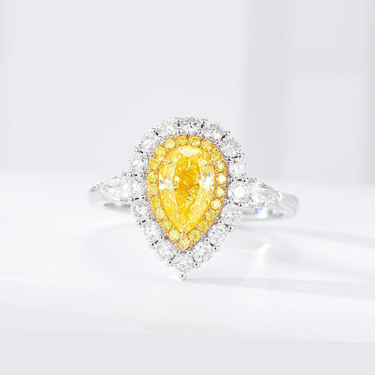 Pear Shaped Yellow Diamond Halo Engagement Ring with Three Stone Setting in 18K White Gold