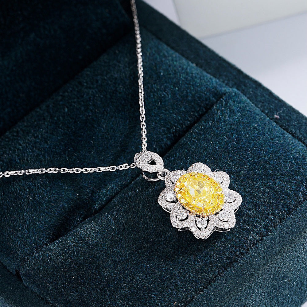 Oval Cut Yellow Diamond Pendant with Sunflower Diamond Halo -Perspective Close-up