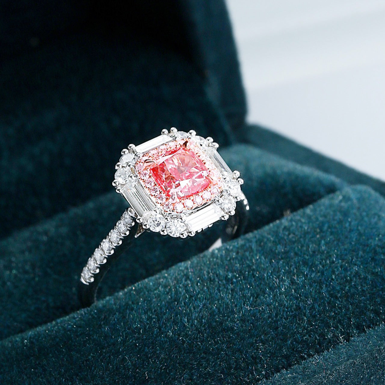 Cushion Cut Pink Diamond Halo Ring with Baguette and Round Accents -Perspective Close-up