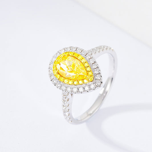Pear Shaped Yellow Diamond Engagement Ring with Pavé Halo Setting in White Gold