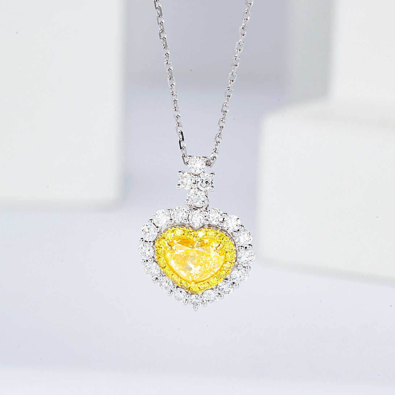 Heart Shaped Yellow Diamond Halo Pendant in 18K White Gold with Cable Chain -Front View
