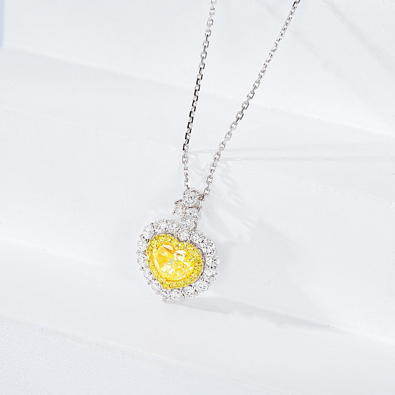 Heart Shaped Yellow Diamond Halo Pendant in 18K White Gold with Cable Chain -Side Angle