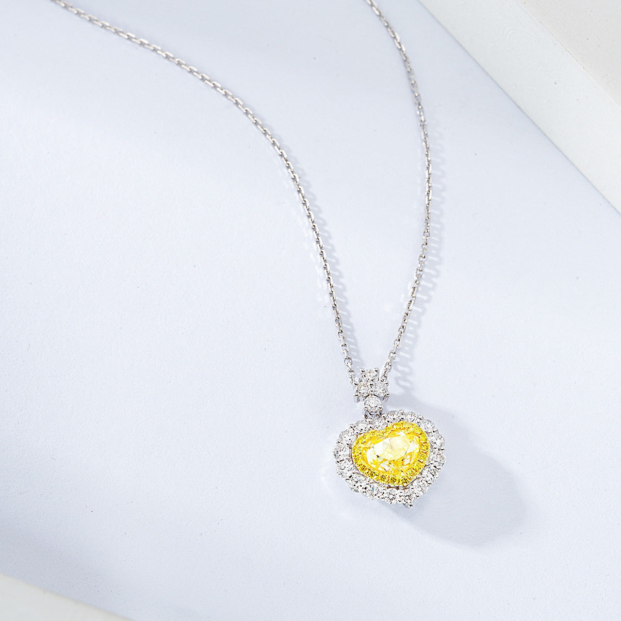 Heart Shaped Yellow Diamond Halo Pendant in 18K White Gold with Cable Chain -Top View
