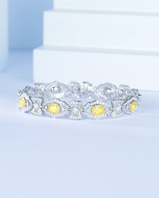 Oval Cut Yellow Diamond Station Designer Bracelet in 18K White Gold