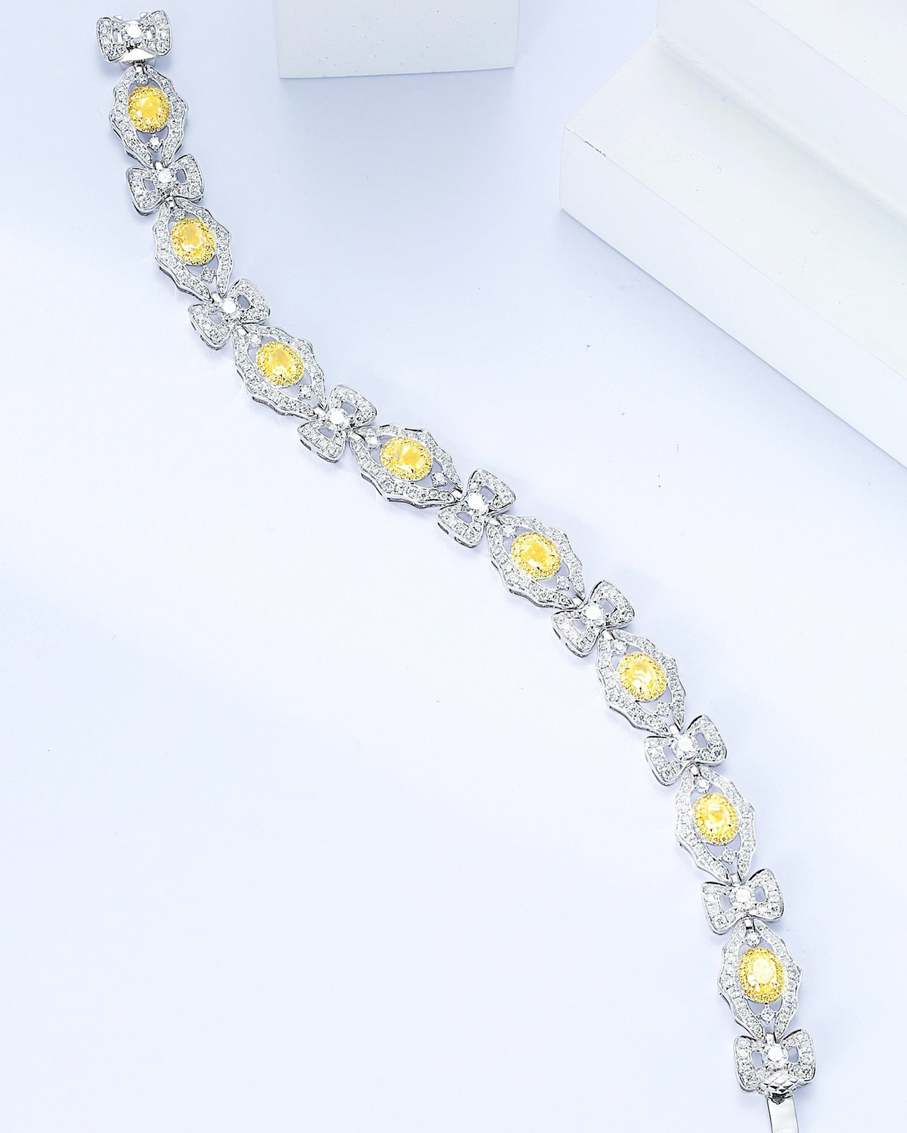 Oval Cut Yellow Diamond Station Designer Bracelet in 18K White Gold -Top View