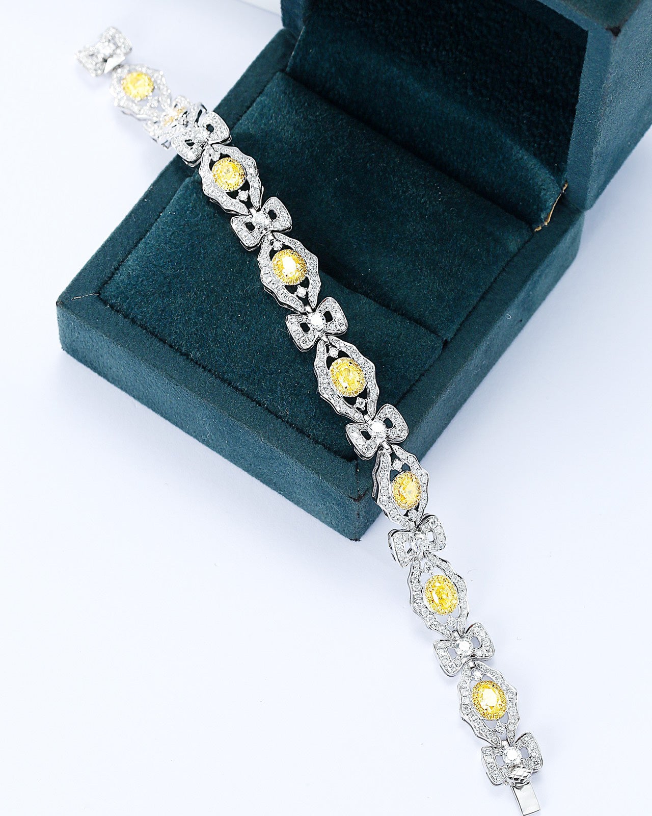Oval Cut Yellow Diamond Station Designer Bracelet in 18K White Gold -Perspective Close-up