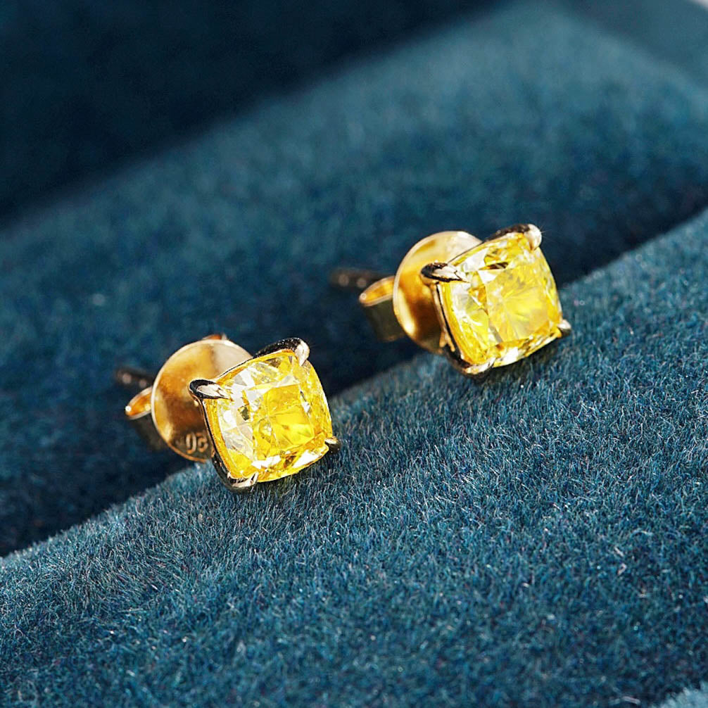Cushion Cut Yellow Diamond Solitaire Stud Earrings -Perspective Close-up