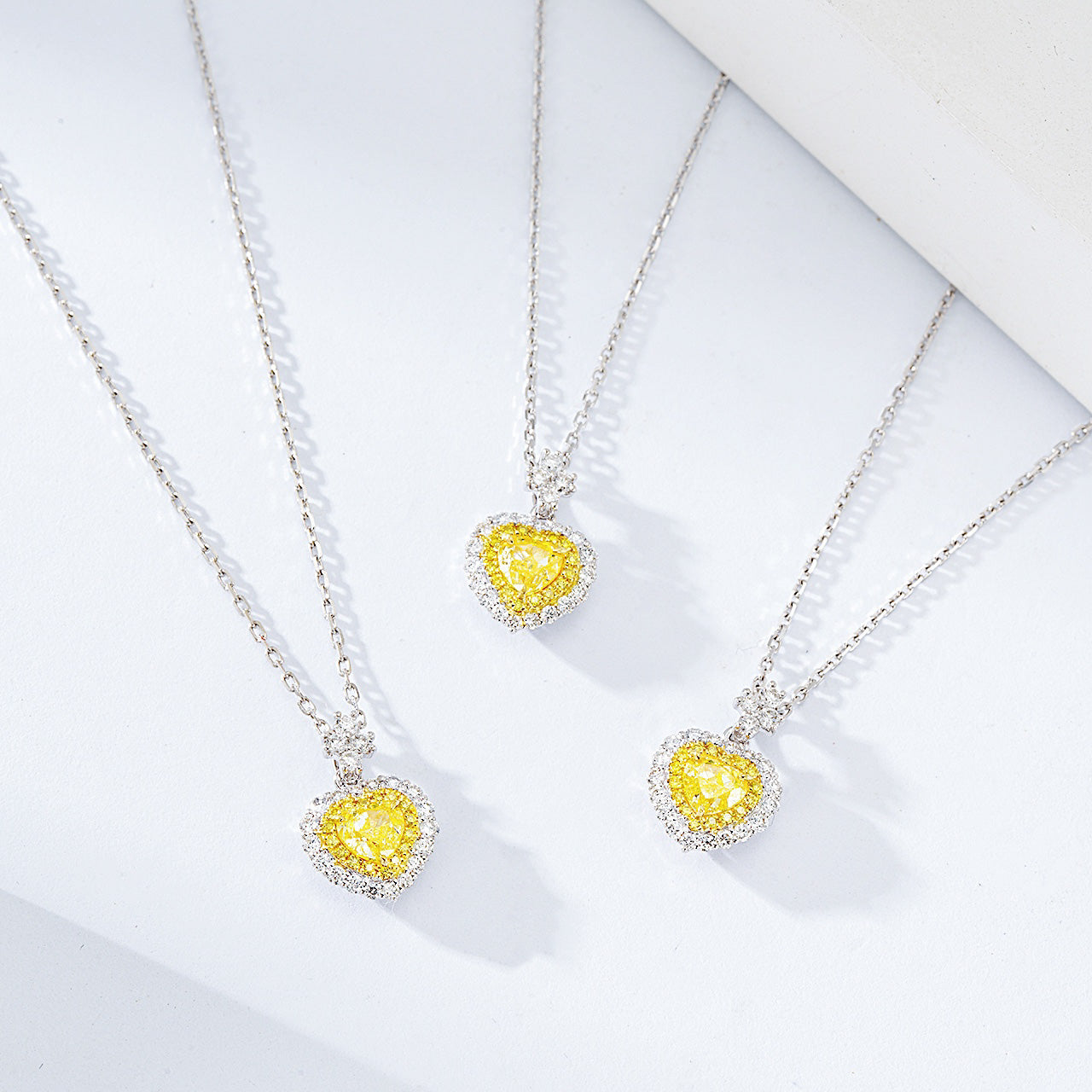 Heart Shaped Yellow Diamond Halo Pendant in 18K White Gold -Side Angle