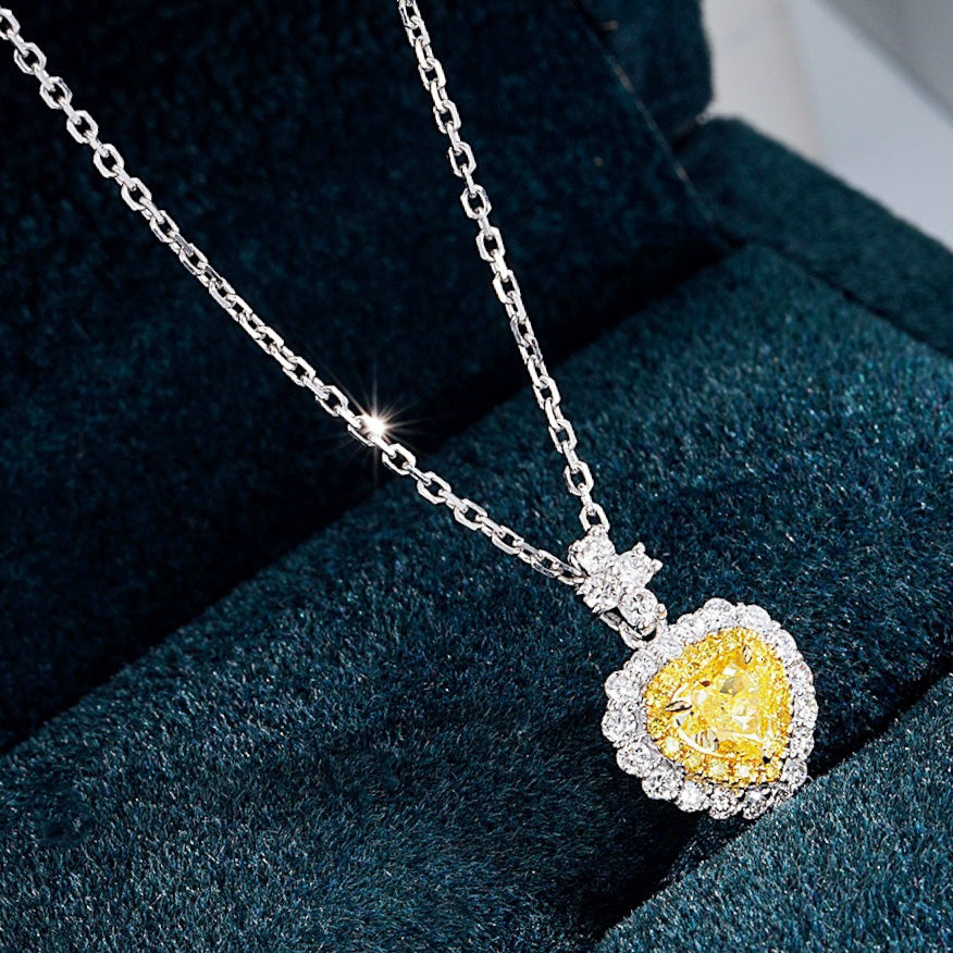 Heart Shaped Yellow Diamond Halo Pendant in 18K White Gold -Perspective Close-up