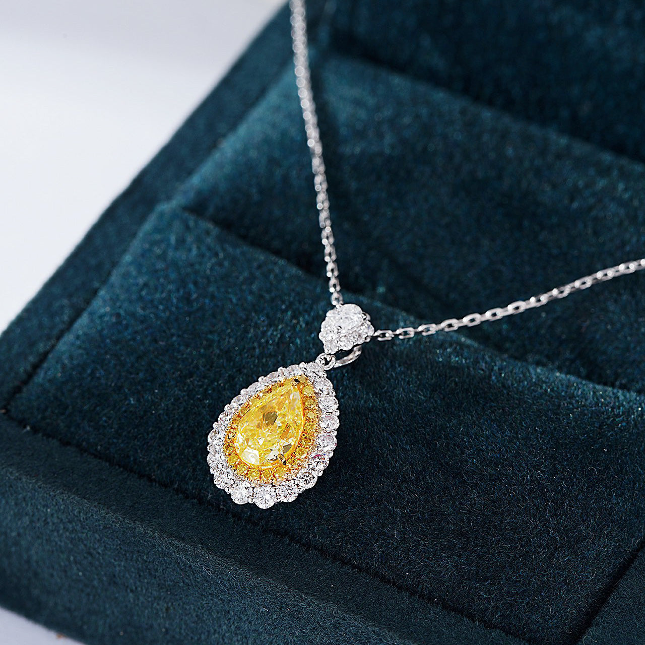 Pear Shaped Yellow Diamond Halo Pendant with Full Diamond Setting -Perspective Close-up