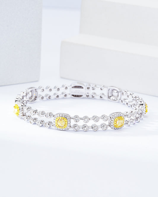 Cushion Cut Yellow Diamond Tennis Station Bracelet in 18K White Gold