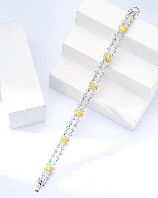 Cushion Cut Yellow Diamond Tennis Station Bracelet in 18K White Gold