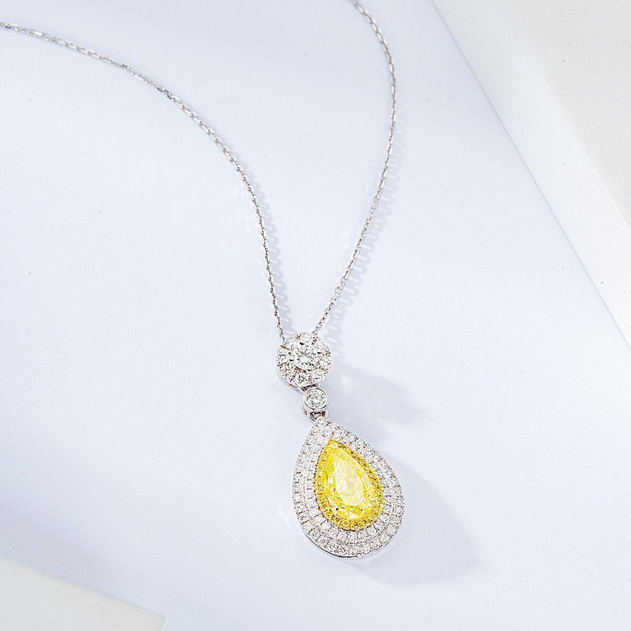 Pear Shaped Yellow Diamond Double Halo Pendant in 18K White Gold -Side Angle