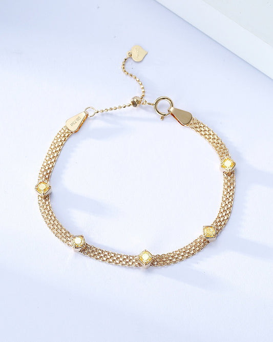 Five Cushion Cut Yellow Diamond Braided Station Bracelet in 18K Yellow Gold