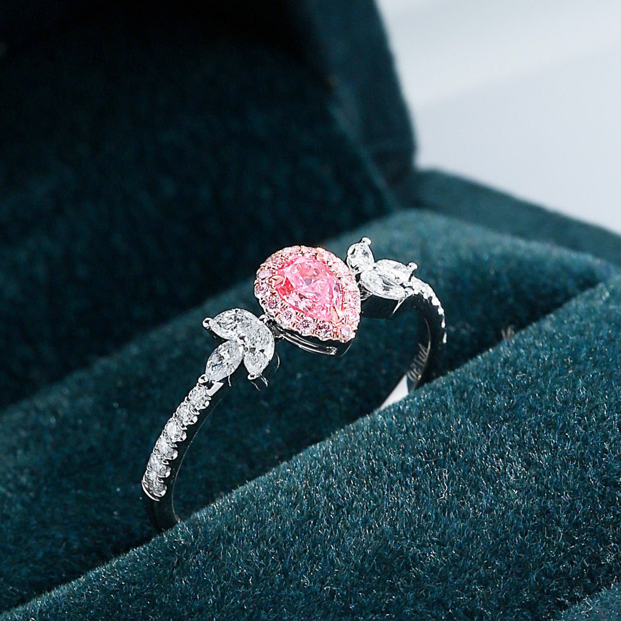 Oval Shaped Pink Diamond Ring with Nature Inspired Leaf Accents -Perspective Close-up