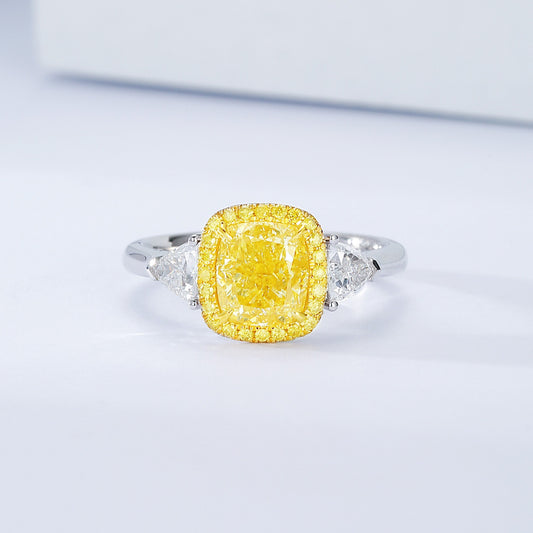 Cushion Cut Yellow Diamond Halo Engagement Ring with Three Stone Setting