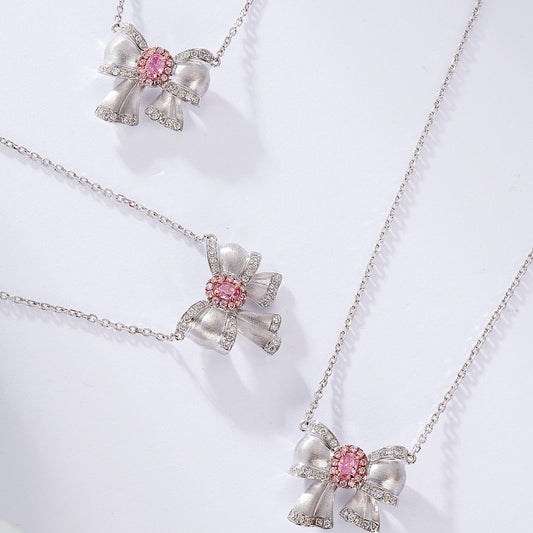 Oval Cut Pink Diamond Pendant with Butterfly Bow Design in 18K White Gold
