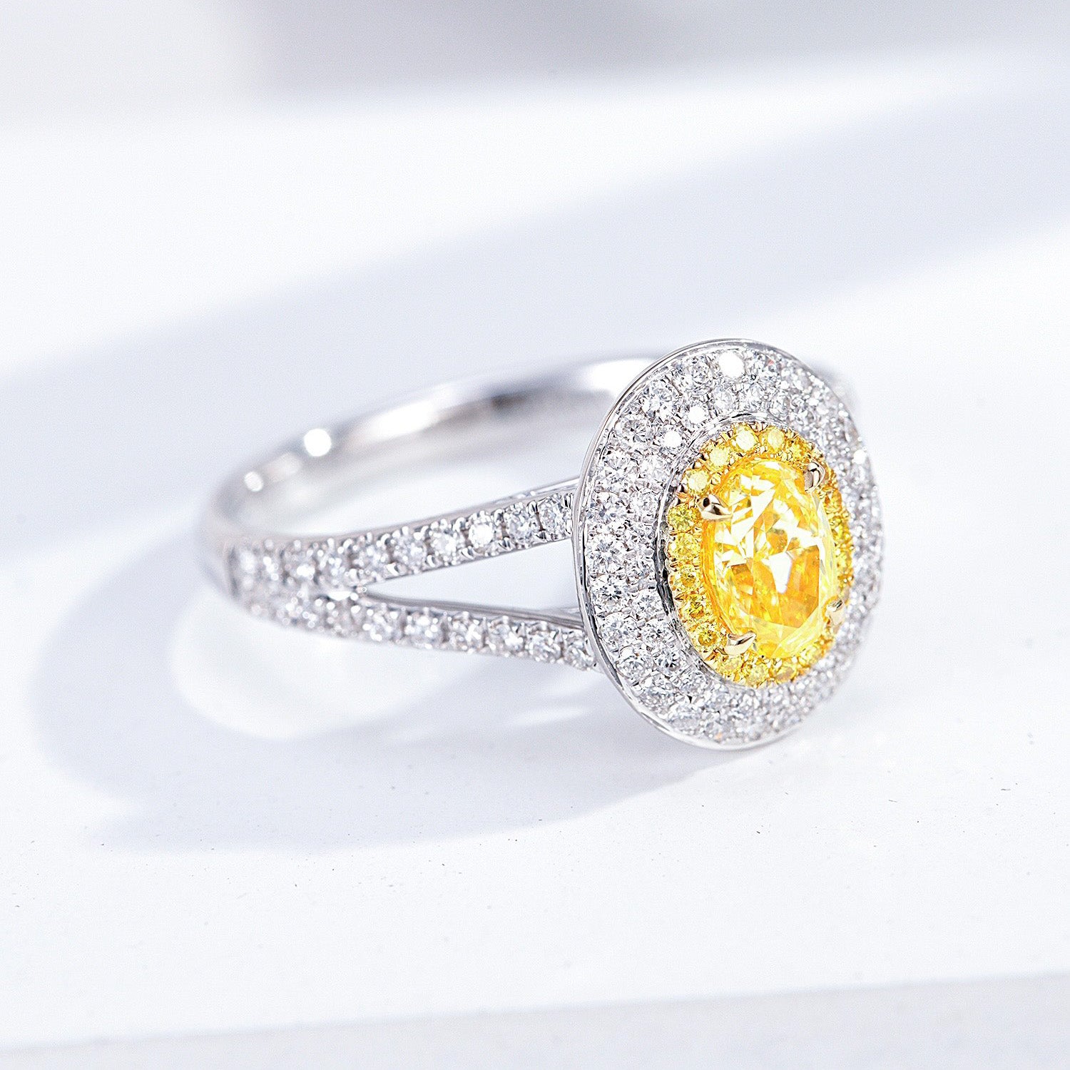 Oval Cut Yellow Diamond Engagement Ring with Pavé Halo Setting in 18K White Gold -Top View