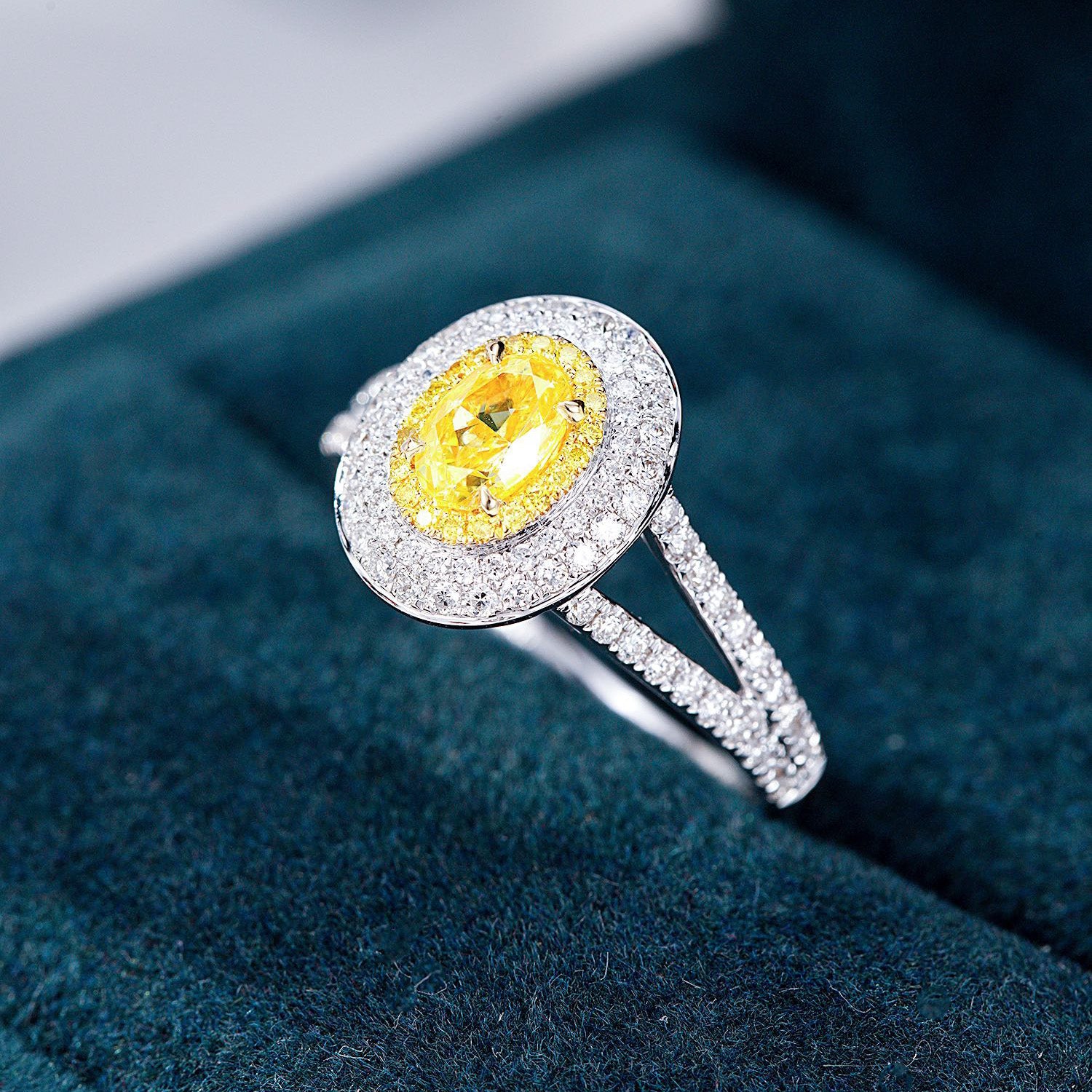 Oval Cut Yellow Diamond Engagement Ring with Pavé Halo Setting in 18K White Gold -In-Box Display