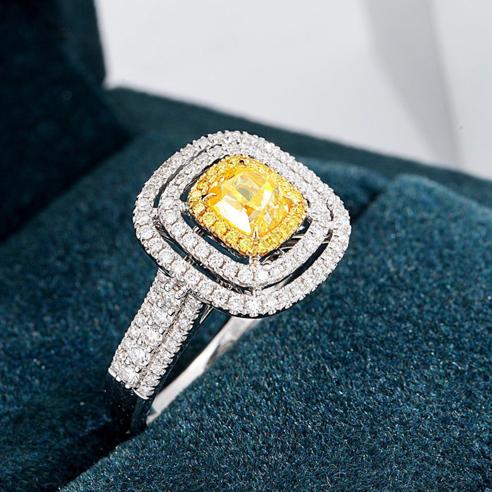 Cushion Cut Yellow Diamond Engagement Ring with Pavé Halo Setting in 18K White Gold -Perspective Close-up