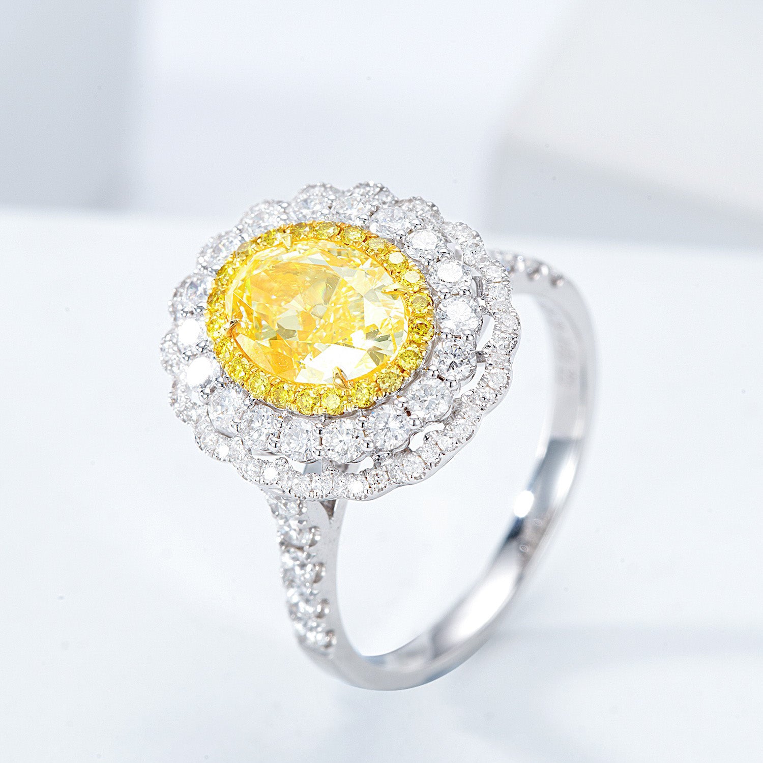 Oval Cut Yellow Diamond Engagement Ring with Pavé Halo Setting in 18K White Gold -Side Angle