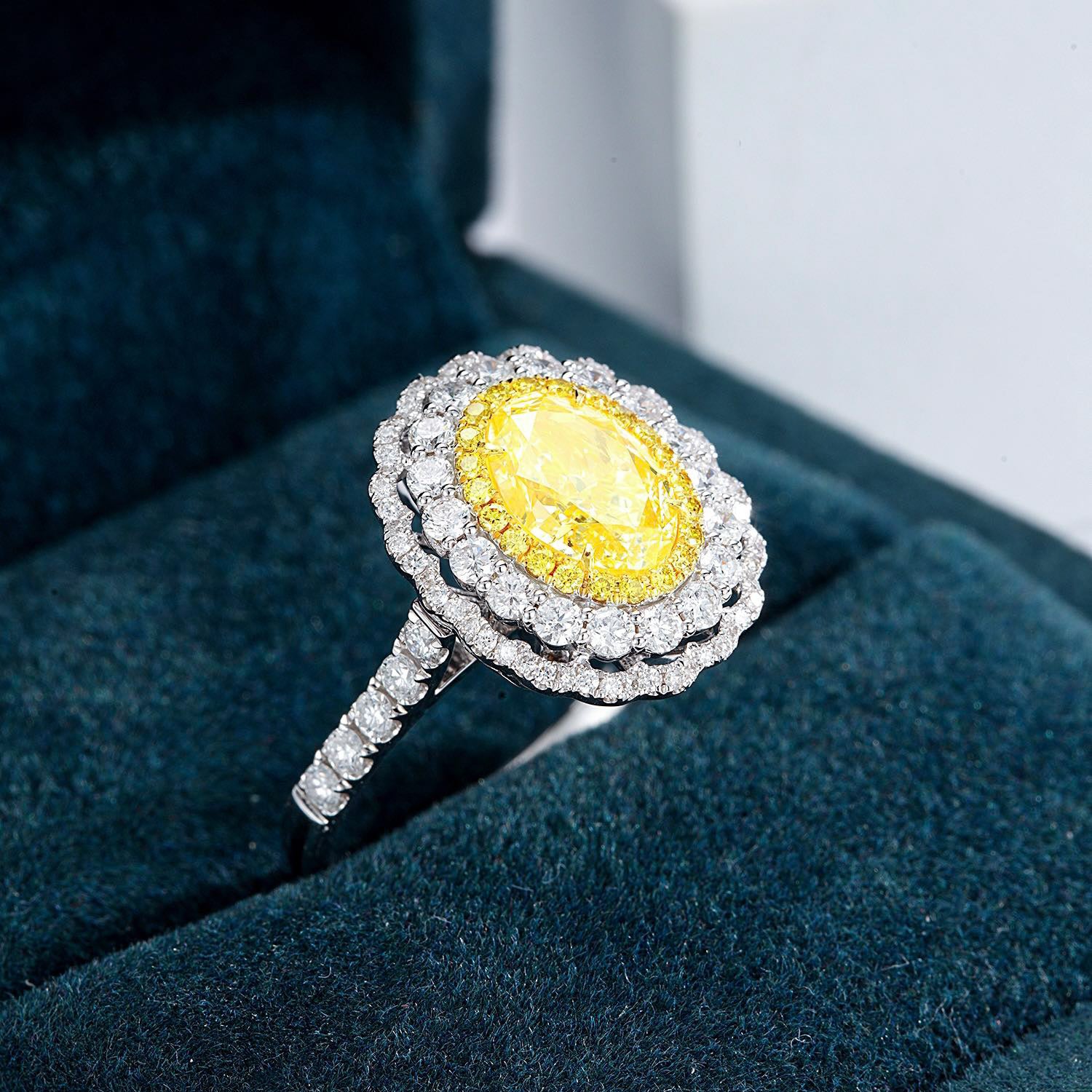 Oval Cut Yellow Diamond Engagement Ring with Pavé Halo Setting in 18K White Gold -Perspective Close-up