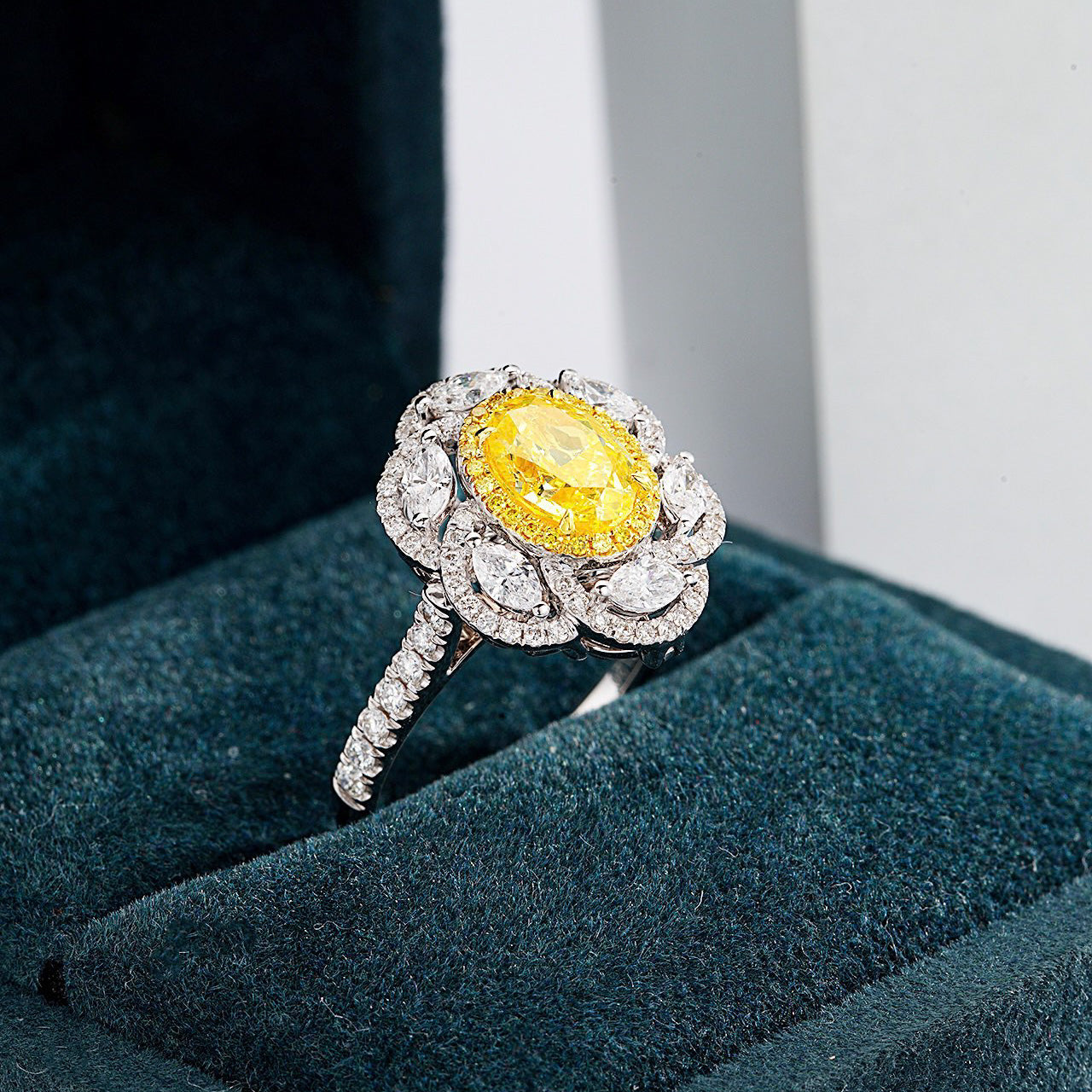 Oval Cut Yellow Diamond Halo Engagement Ring with with Marquise Accents -Perspective Close-up