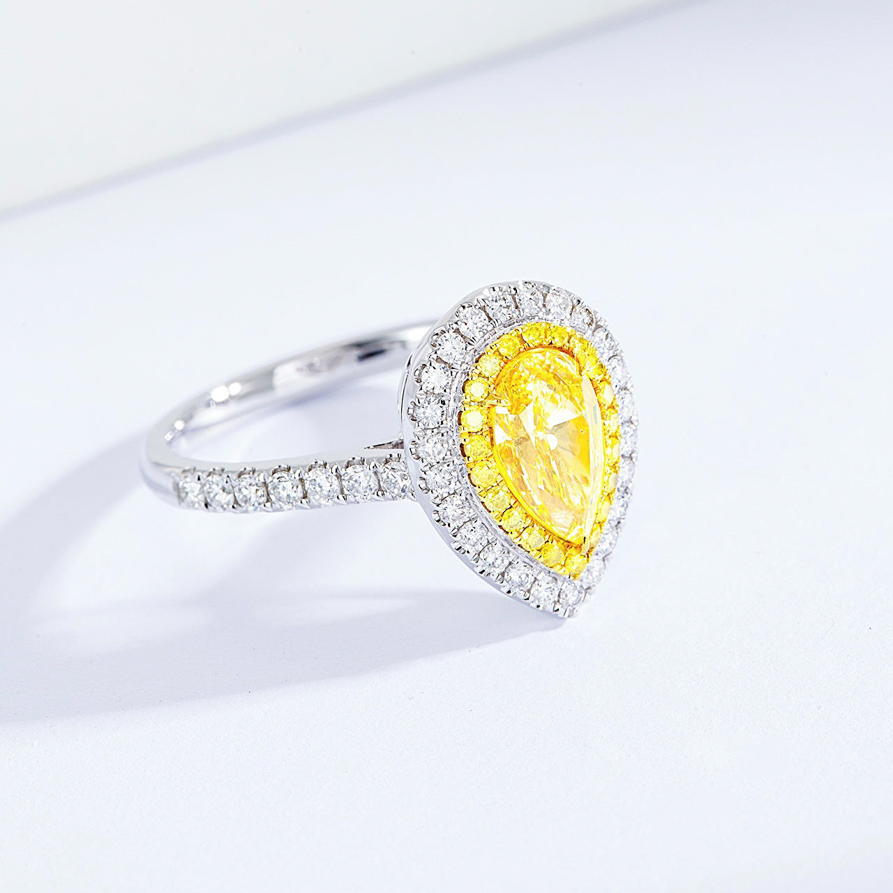 Pear Shaped Yellow Diamond Engagement Ring with Pavé Halo Setting in White Gold -Top View