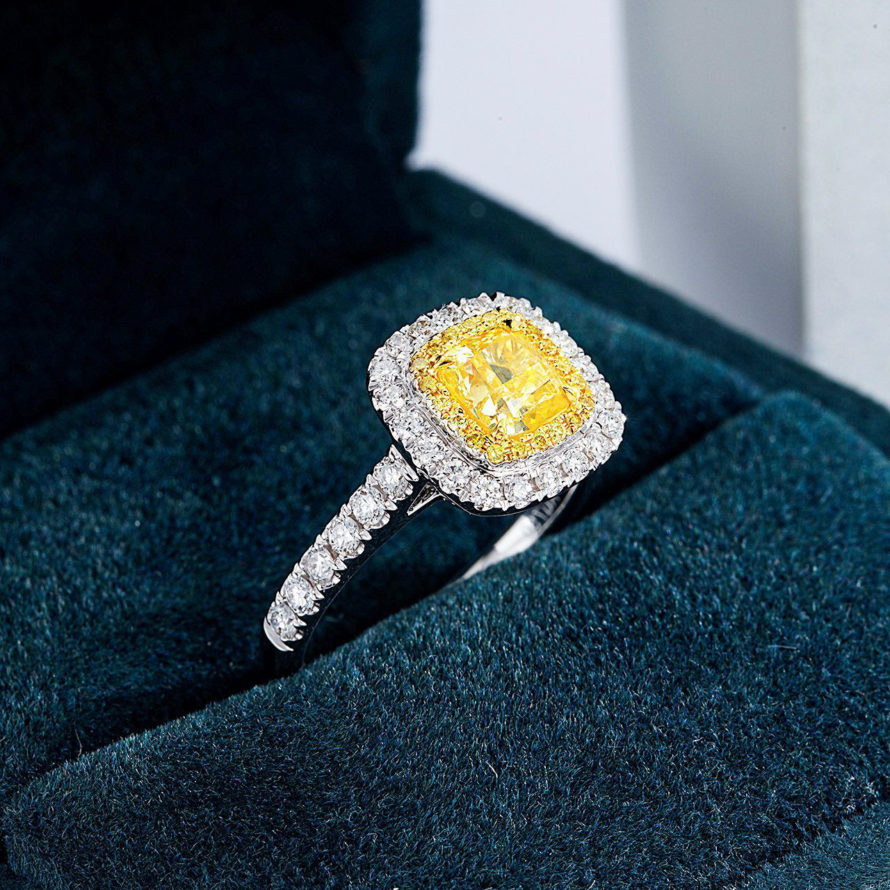 Cushion Cut Yellow Diamond Engagement Ring with Pavé Halo Setting in 18K White Gold -Perspective Close-up