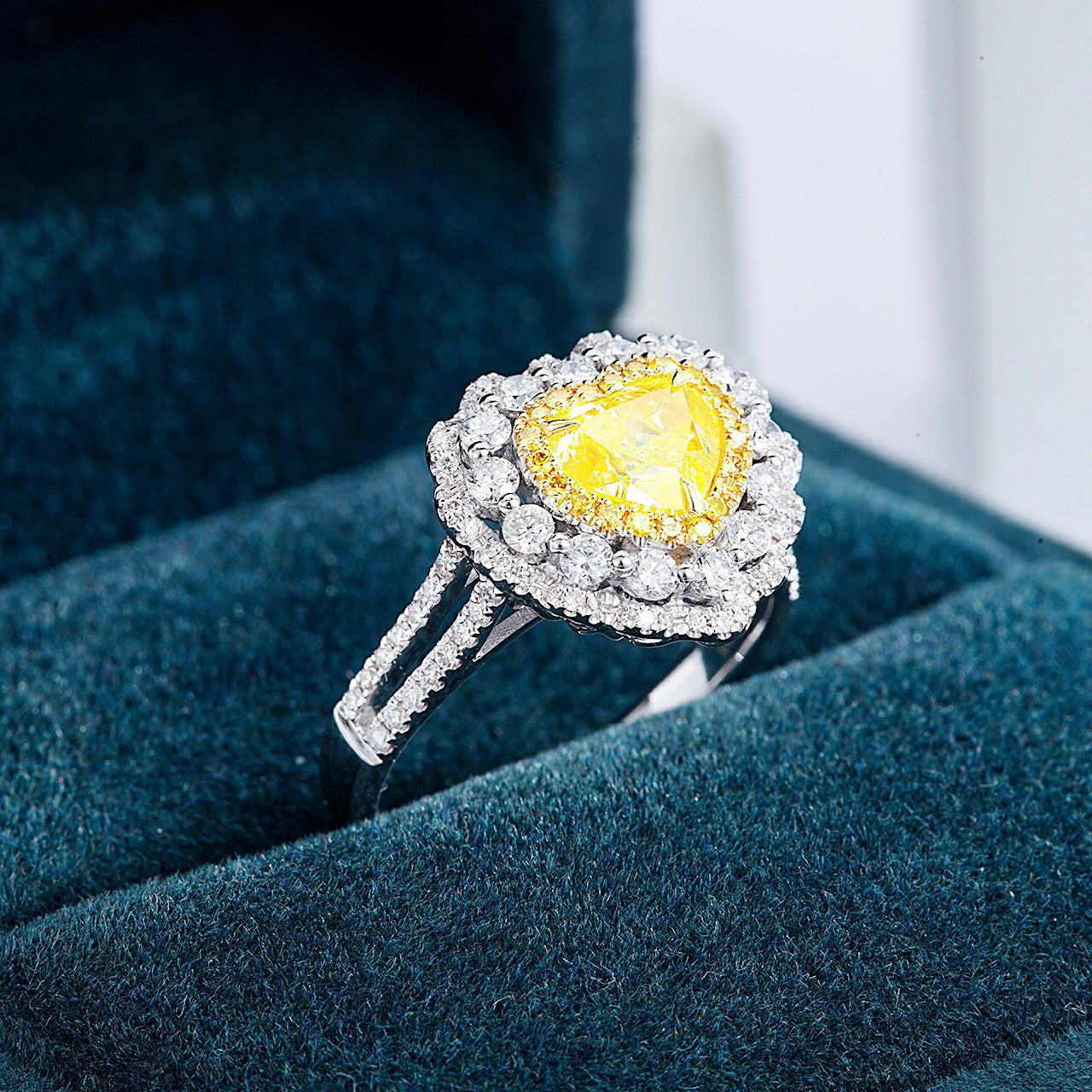 Heart Shaped Yellow Diamond Engagement Ring with Pavé Halo Setting -Perspective Close-up