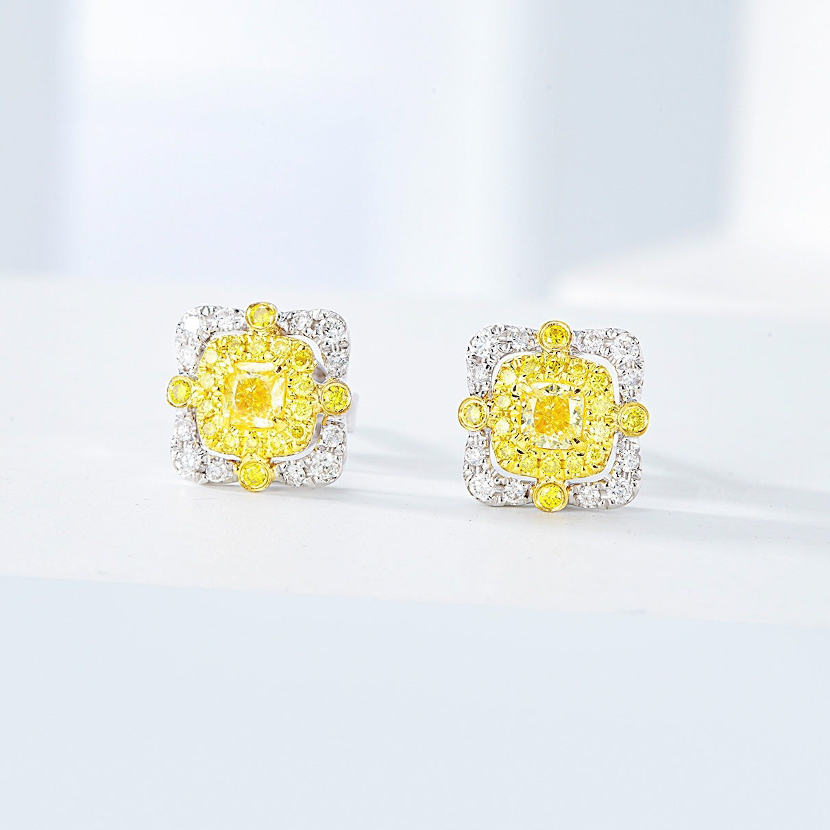 Cushion Cut Yellow Diamond Stud Earrings in 18K White Diamond -Side Angle