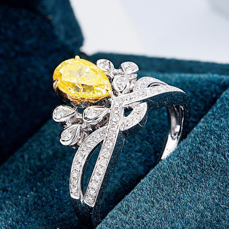 Pear Shaped Yellow Diamond Crown Ring with Channel Setting in 18K White Gold -Perspective Close-up