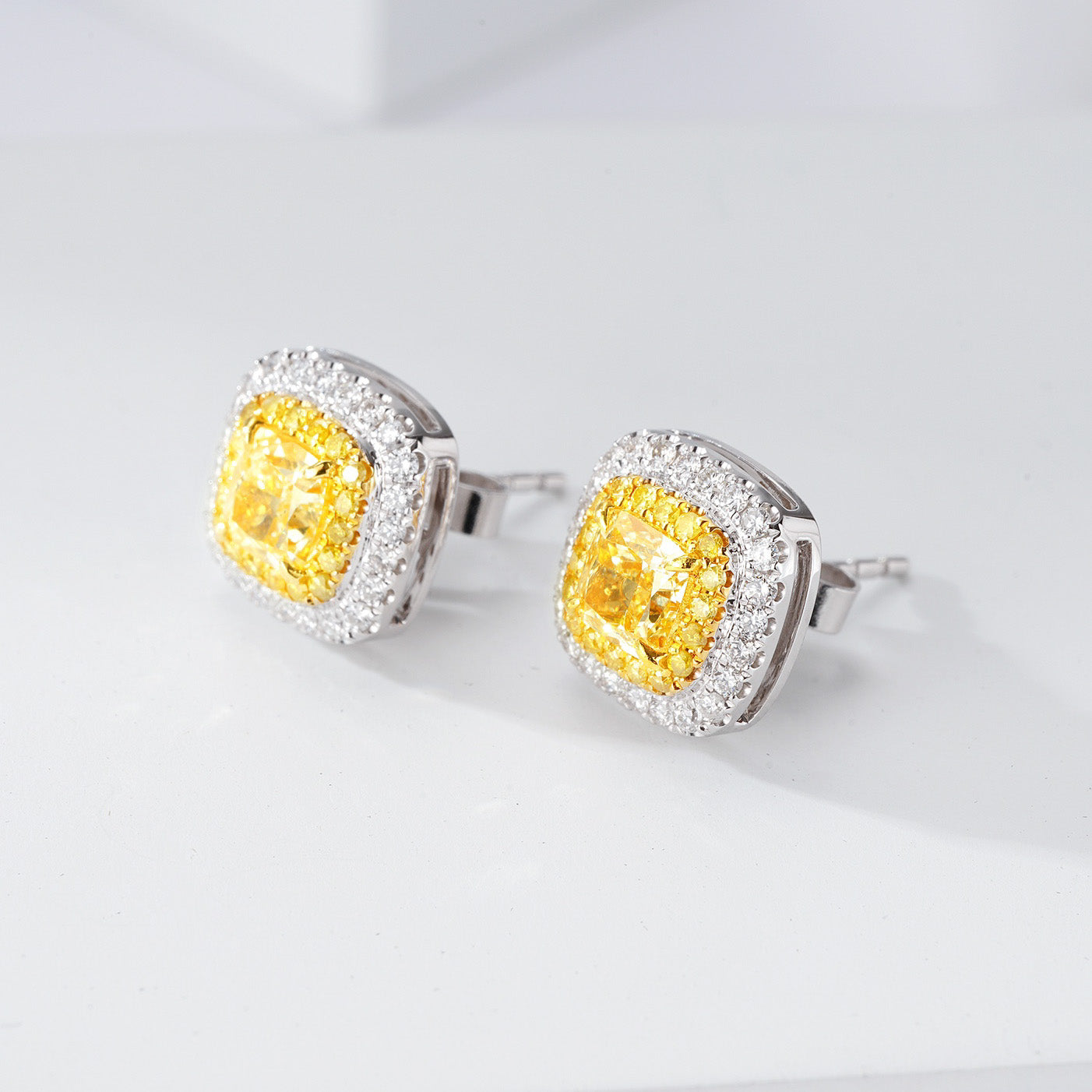 Cushion Cut Yellow Diamond Halo Stud Earrings in 18K White Gold -Side Angle