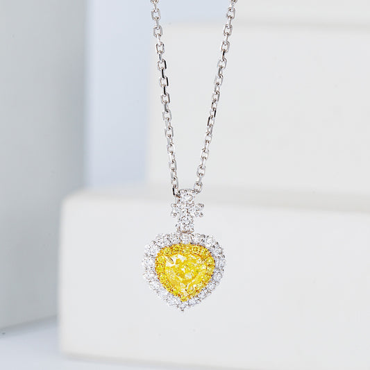 Heart Shaped Yellow Diamond Halo Pendant in 18K White Gold