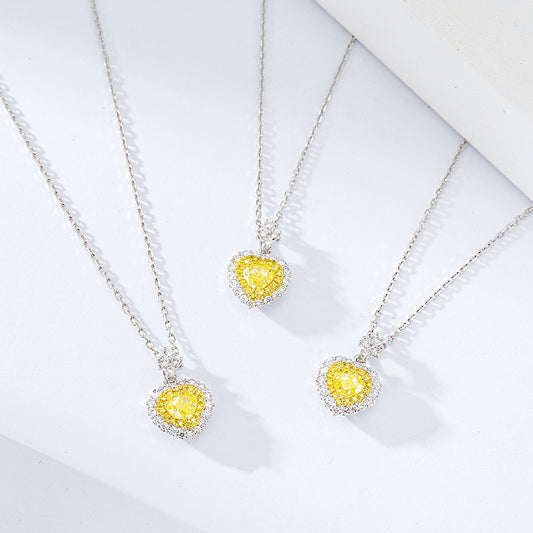 Heart Shaped Yellow Diamond Halo Pendant in 18K White Gold