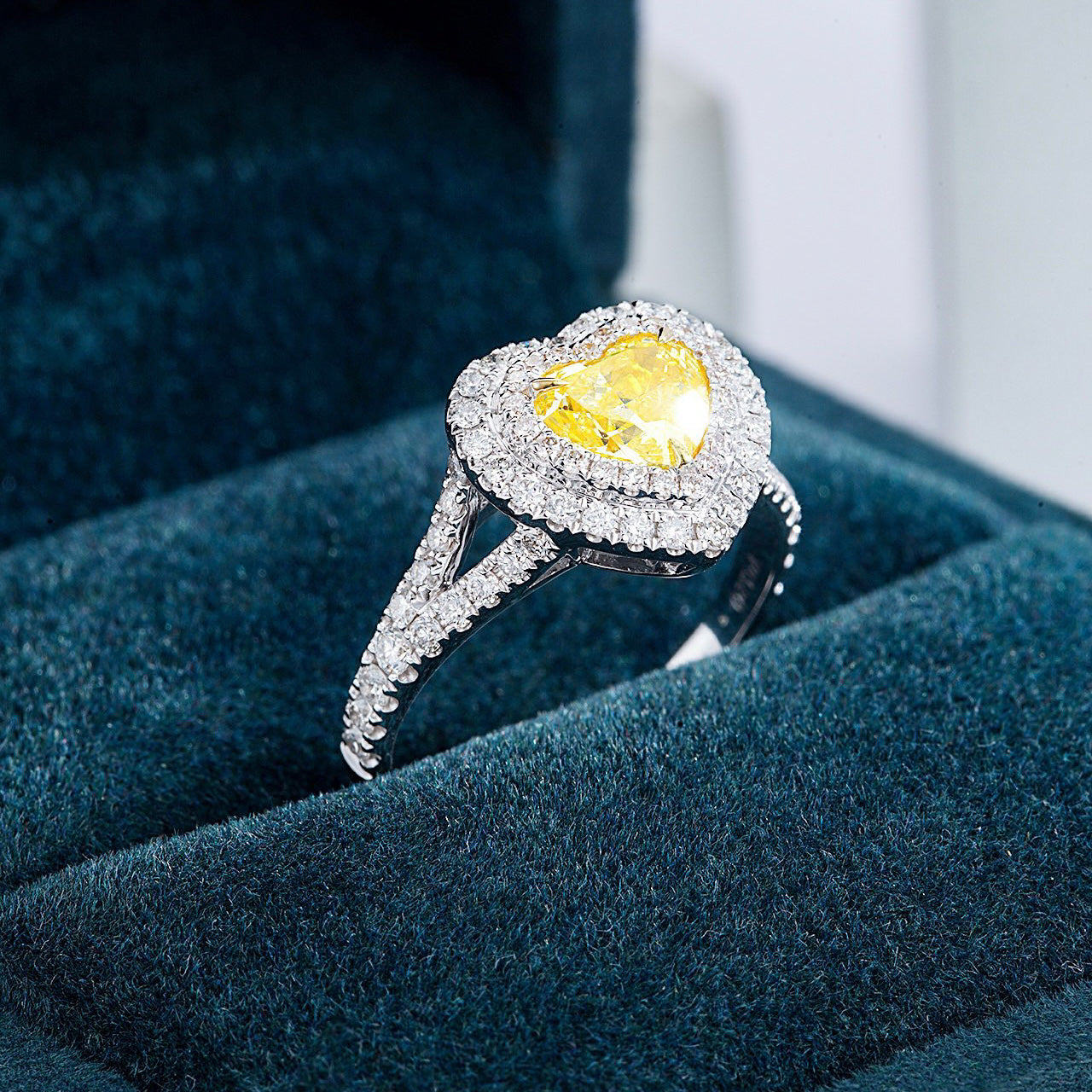 Heart Shaped Yellow Diamond Engagement Ring with Pavé and Halo Setting -Perspective Close-up