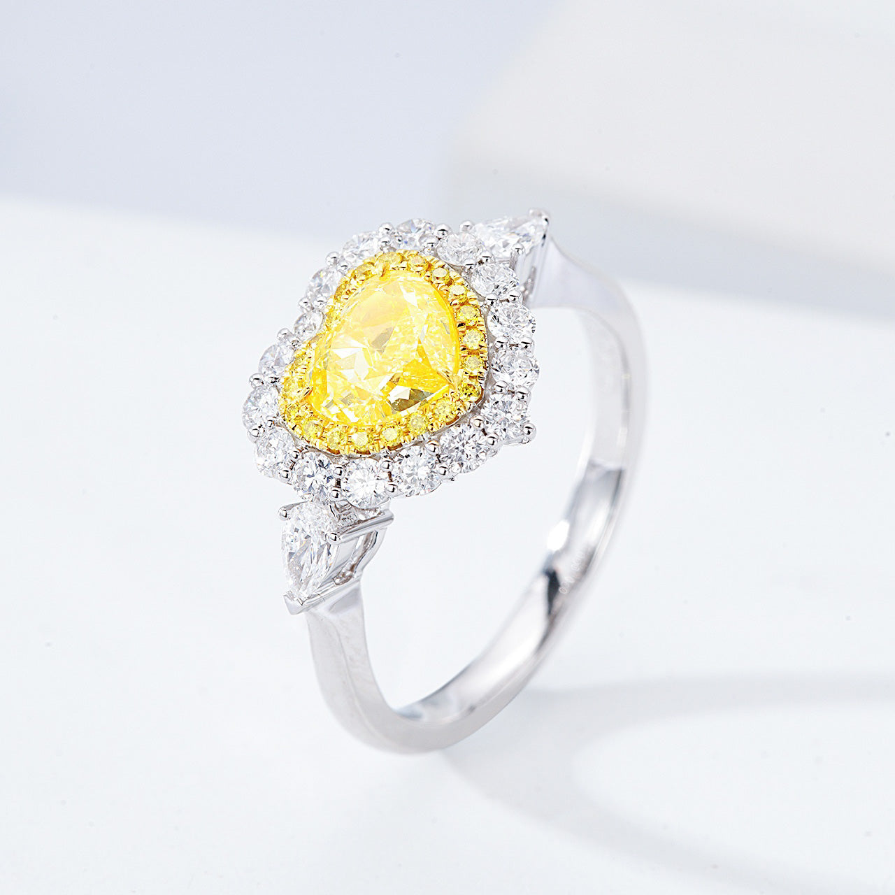 Heart Shaped Yellow Diamond Halo Engagement Ring with Three Stone Setting -Side Angle