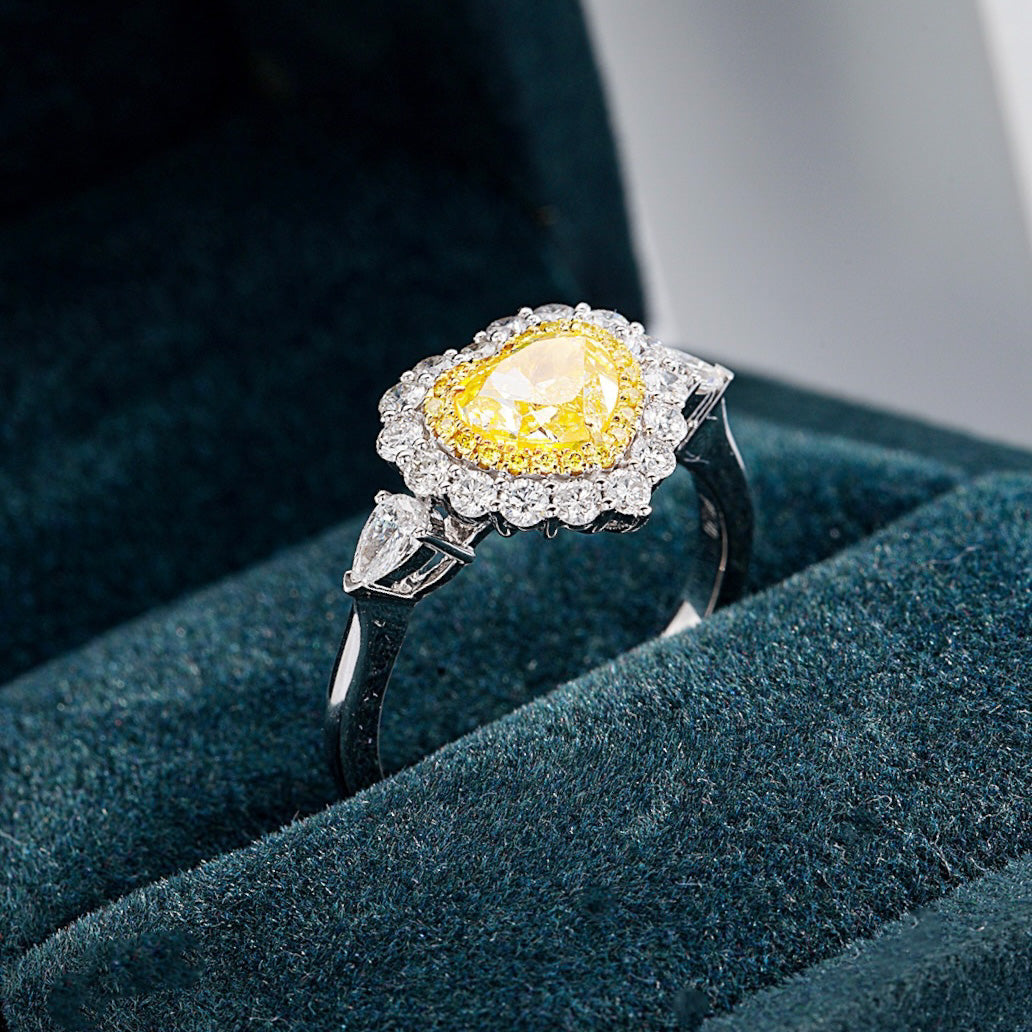 Heart Shaped Yellow Diamond Halo Engagement Ring with Three Stone Setting -Perspective Close-up