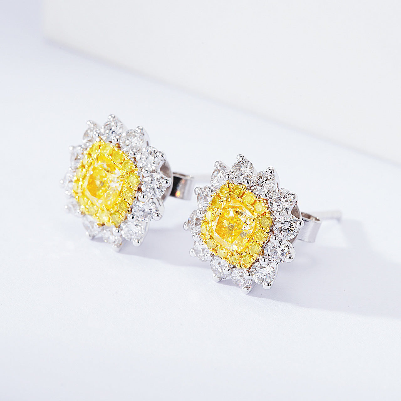 Cushion Cut Yellow Diamond Halo Stud Earrings in 18K White Gold -Side Angle