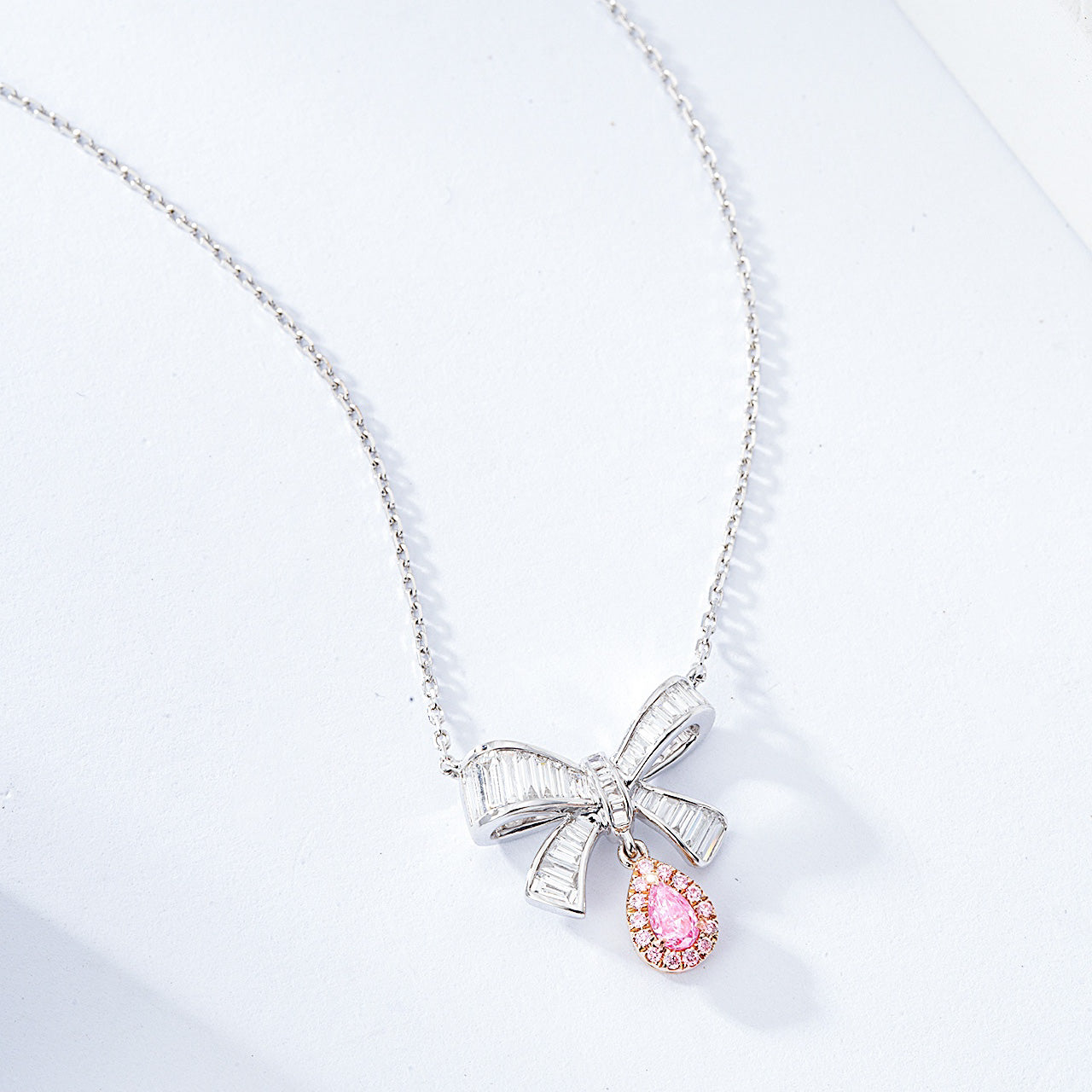 Pear Shaped Pink Diamond Pendant with Butterfly Bow Design in 18K White Gold -Side Angle