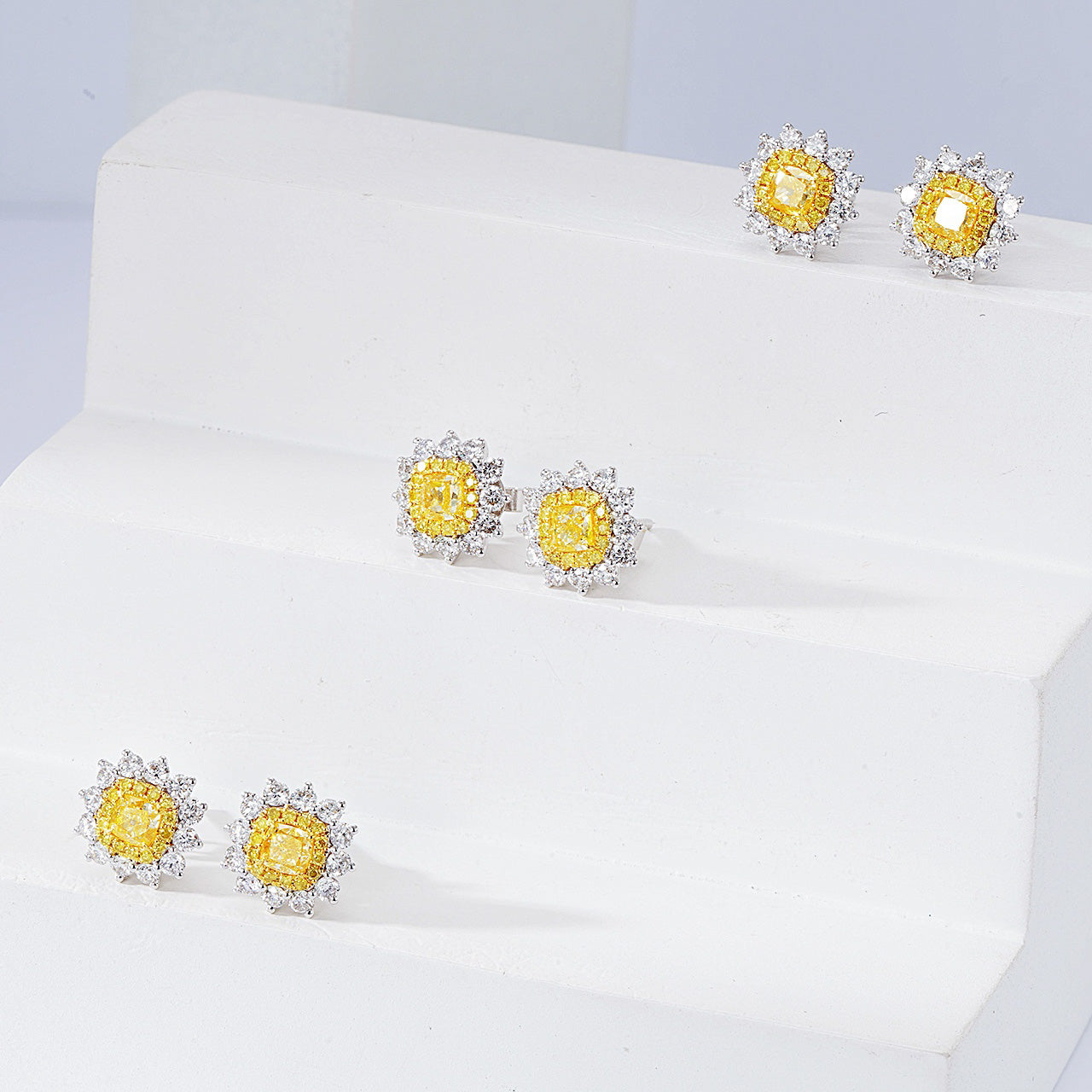 Cushion Cut Yellow Diamond Halo Stud Earrings in 18K White Gold -Perspective Close-up