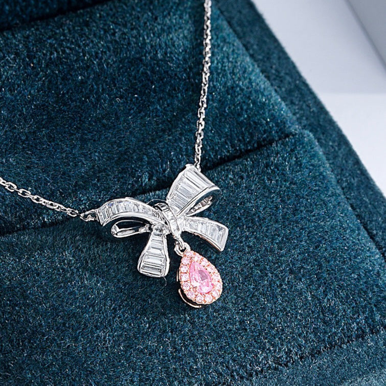 Pear Shaped Pink Diamond Pendant with Butterfly Bow Design in 18K White Gold -Perspective Close-up