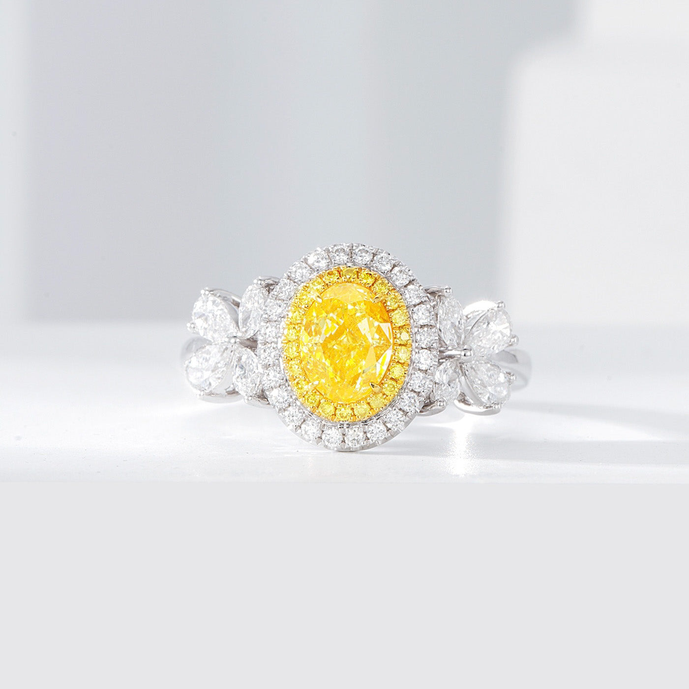 Oval Cut Yellow Diamond Halo Engagement Ring with Pear & Marquise Shaped Side Stones in 18K White Gold -Front View