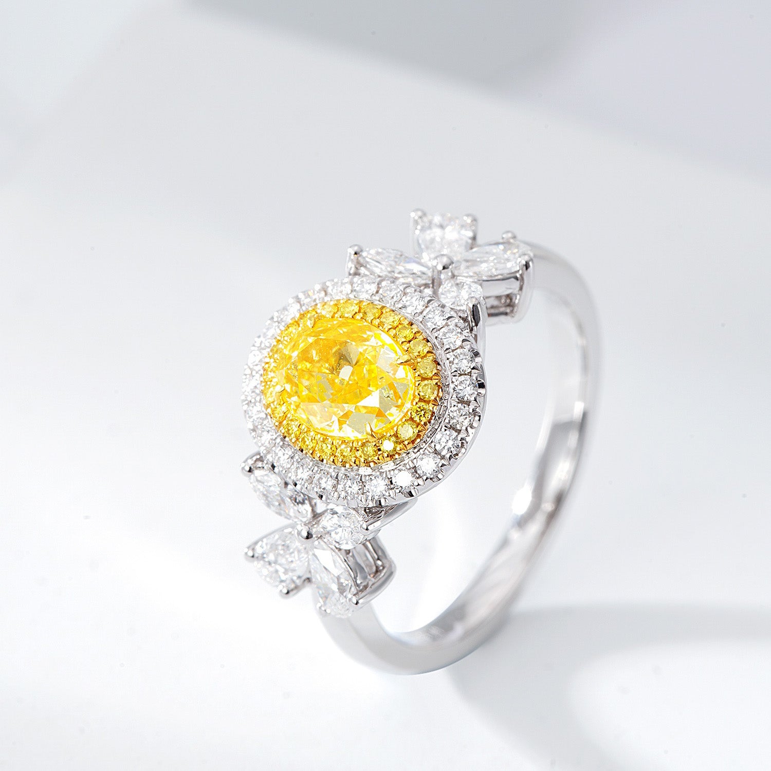 Oval Cut Yellow Diamond Halo Engagement Ring with Pear & Marquise Shaped Side Stones in 18K White Gold -Side Angle