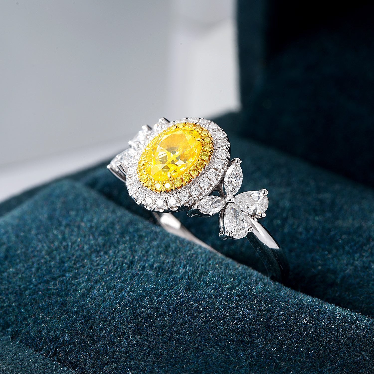 Oval Cut Yellow Diamond Halo Engagement Ring with Pear & Marquise Shaped Side Stones in 18K White Gold -In-Box Display