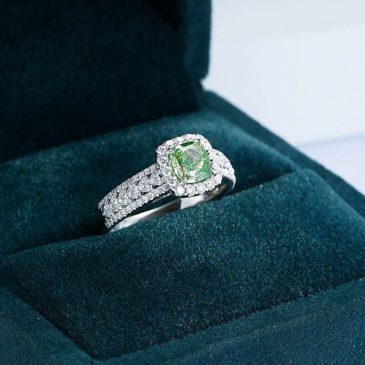 Cushion Cut Green Diamond Halo Engagement Ring with Pavé Band -Perspective Close-up