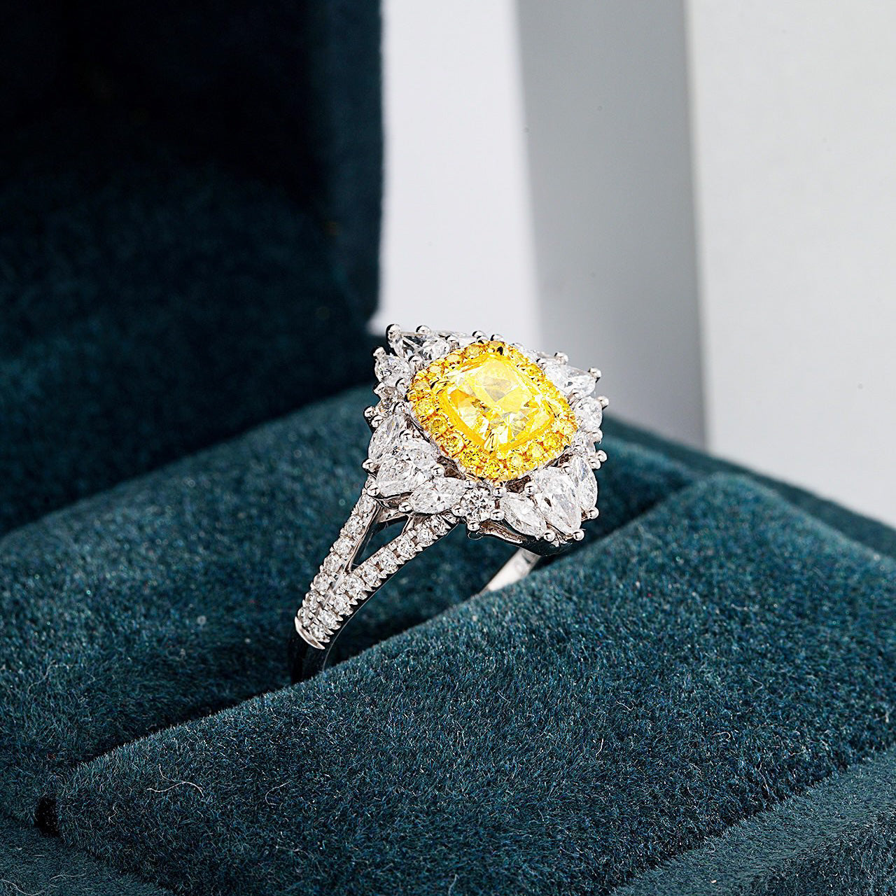 Cushion Cut Yellow Diamond Engagement Ring with Pavé Halo Setting in 18K White Gold -Perspective Close-up