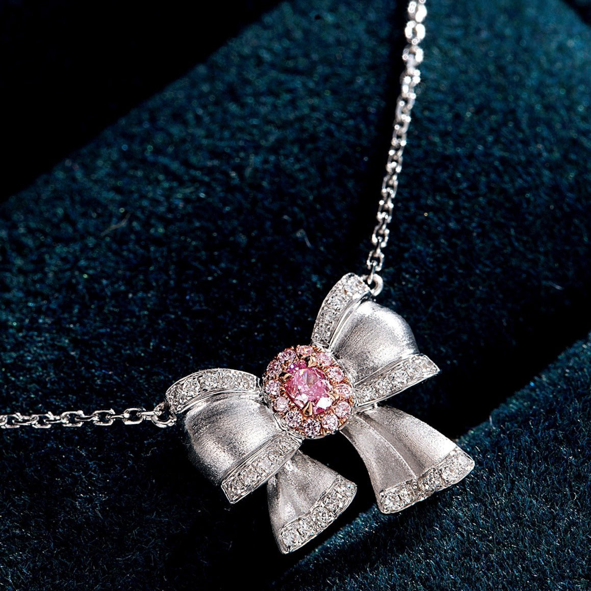 Oval Cut Pink Diamond Pendant with Butterfly Bow Design in 18K White Gold -Perspective Close-up